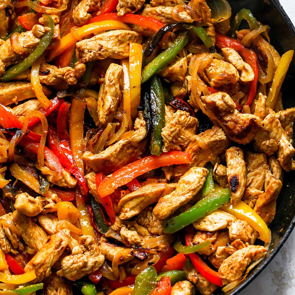 Chicken fajitas with colorful bell peppers and onions